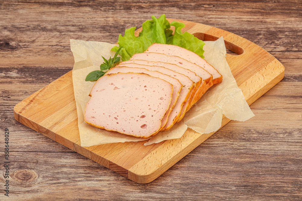 Boiled pork sausage over board