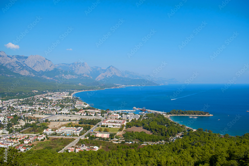 Landscape with city, sea and mountain views. Landscape on the city of Kemer, Turkey, top view.