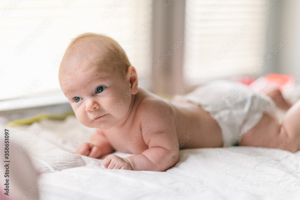 The baby learns to hold its head and lies on its stomach. The benefits