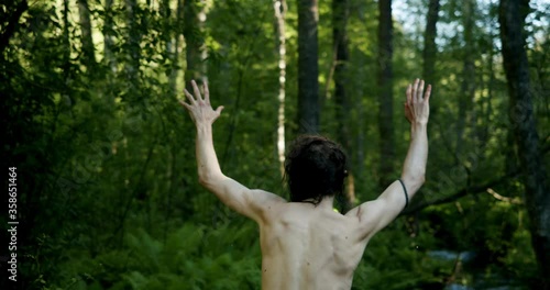 naked man raised his hands and wants to surrender. asks not to shoot. white flag