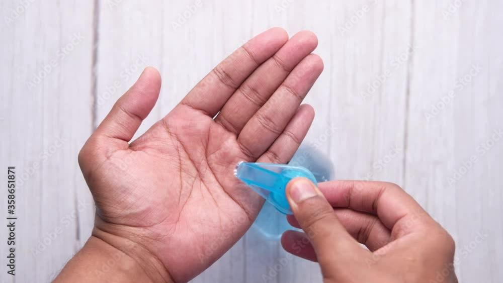 man's hands using hand sanitizer gel, close up man's hands using hand sanitizer gel, close up