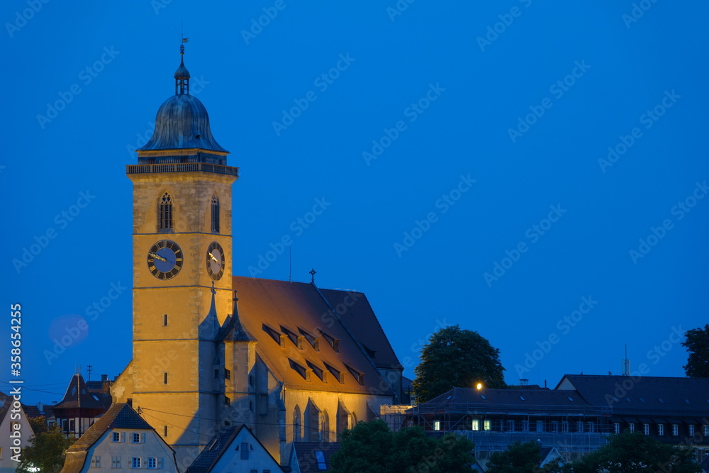 Laurentius church in Nuertingen, yellow tower and blue sky. Germany.