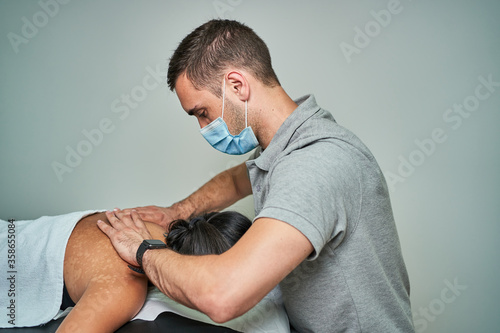 A Woman Getting A Stress Relieving Pressure Point Massage On Her Neck By A Health Therapist