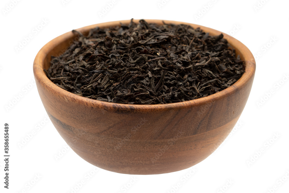 Black tea in a wooden bowl. Black tea in a wooden bowl.