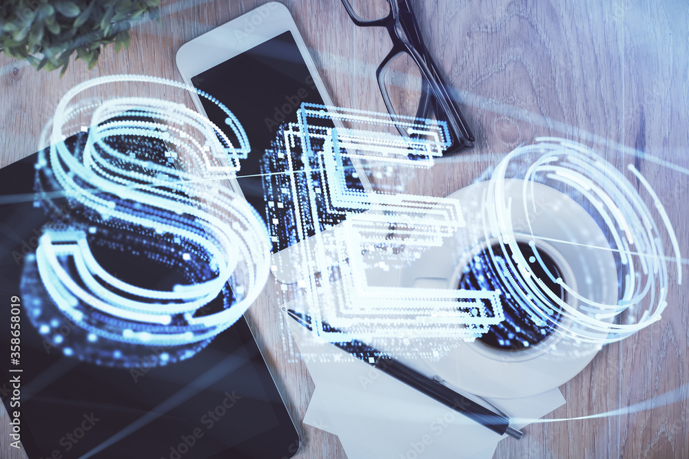 Double exposure of SEO hologram drawing over desktop. Top view. Search optimization concept. Double exposure of SEO hologram drawing over desktop. Top view. Search optimization concept.