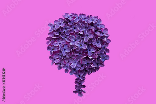 Lilac flowers in the shape of a tree on a pink background