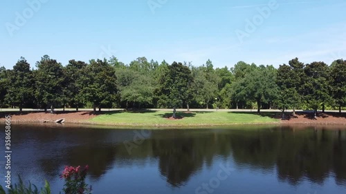 Flying over a lake with a view of forest trees