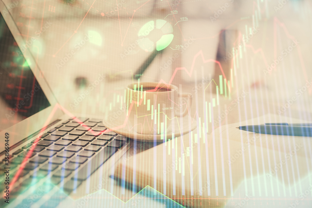 Double exposure of financial chart drawing and desktop with coffee and items on table background. Concept of forex market trading Double exposure of financial chart drawing and desktop with coffee and items on table background. Concept of forex market trading