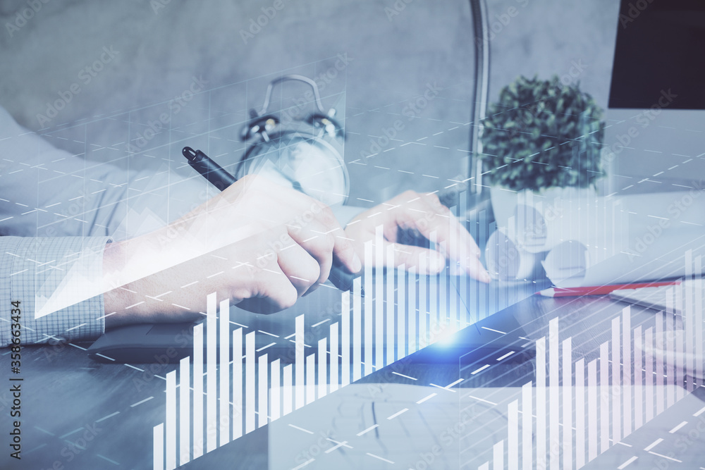 Double exposure of man's hands holding and using a phone and financial graph drawing. Analysis concept. Double exposure of man's hands holding and using a phone and financial graph drawing. Analysis concept.