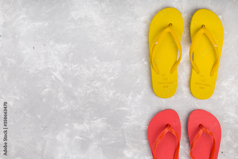 Summer flip flop shoes on grey background Summer flip flop shoes on grey background