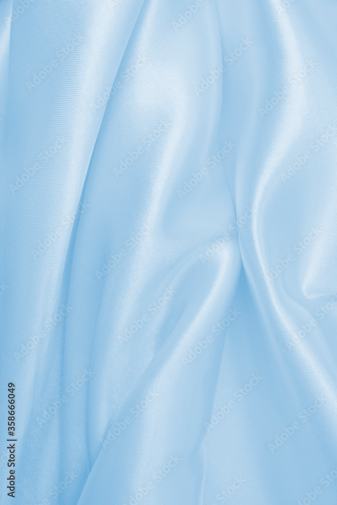 Fototapeta premium Smooth elegant blue silk or satin luxury cloth texture as abstract background. Luxurious background design