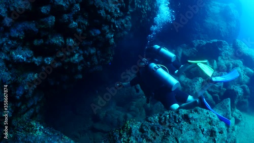 Wallpaper Mural cave diving underwater scuba divers exploring caves ocean scenery sun beams and rays background Torontodigital.ca