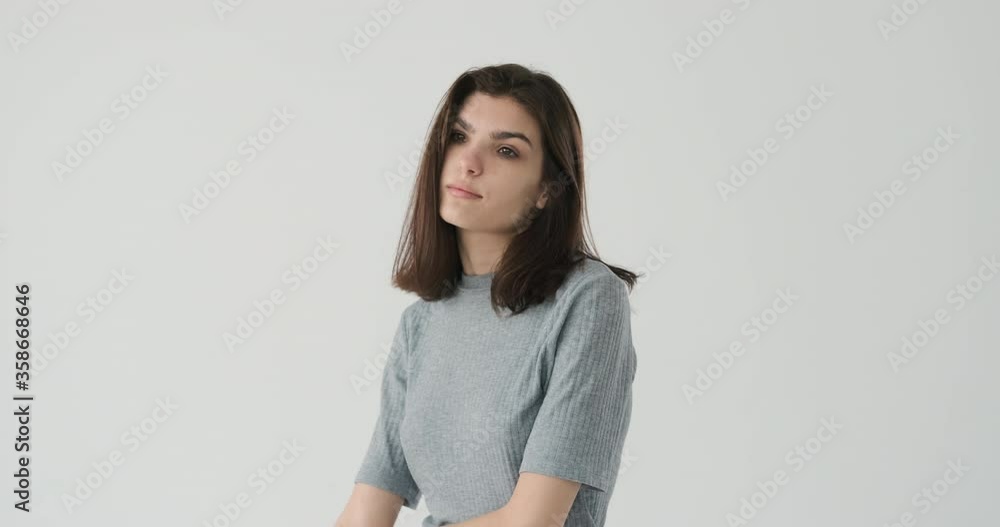 Impatient and bored woman leaving after waiting for someone over white background Impatient and bored woman leaving after waiting for someone over white background