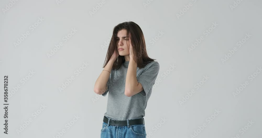 Woman suffering from a severe headache Woman suffering from a severe headache