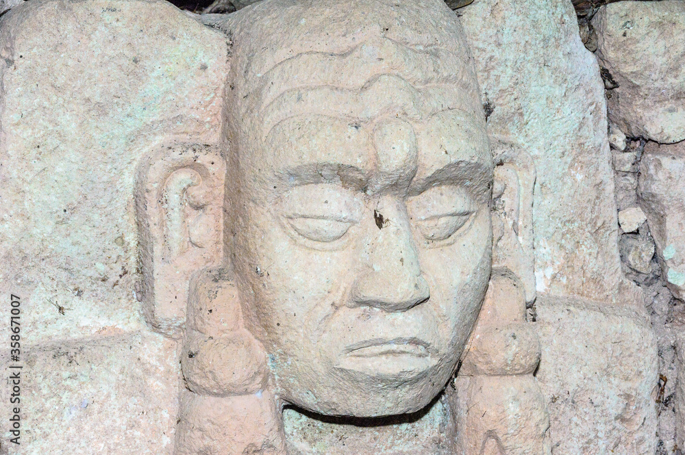 It's Sculpted head stone at Mayan archeological site, Copan Ruins, Honduras, Central America