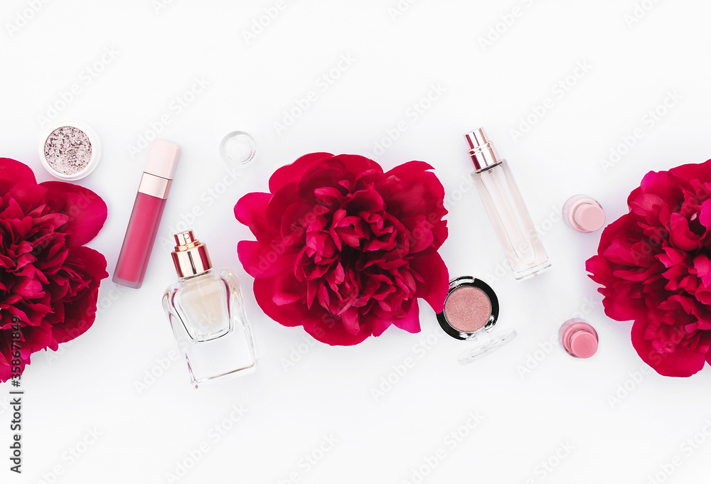 Trendy design template with pink cosmetics layout decorated with wine red peonies on white background. Flat lay style. Copy space. Mockup for your design. Trendy design template with pink cosmetics layout decorated with wine red peonies on white background. Flat lay style. Copy space. Mockup for your design.