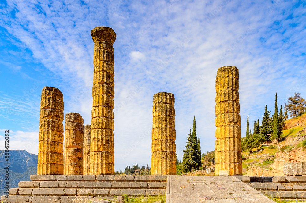 It's Apollo Temple in Delphi, an archaeological site in Greece, at the Mount Parnassus. Delphi is famous by the oracle at the sanctuary dedicated to Apollo. UNESCO World heritage It's Apollo Temple in Delphi, an archaeological site in Greece, at the Mount Parnassus. Delphi is famous by the oracle at the sanctuary dedicated to Apollo. UNESCO World heritage