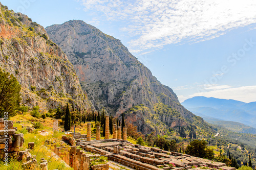 It's Apollo Temple in Delphi, an archaeological site in Greece, at the Mount Parnassus. Delphi is famous by the oracle at the sanctuary dedicated to Apollo. UNESCO World heritage
