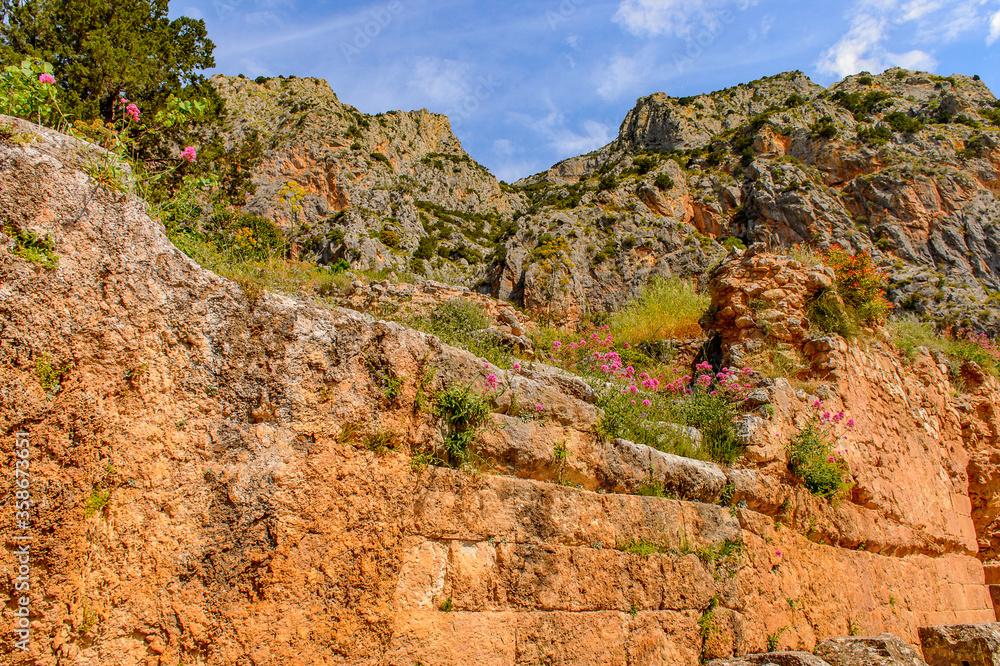 It's Delphi, an archaeological site in Greece, at the Mount Parnassus. Delphi is famous by the oracle at the sanctuary dedicated to Apollo. UNESCO World heritage It's Delphi, an archaeological site in Greece, at the Mount Parnassus. Delphi is famous by the oracle at the sanctuary dedicated to Apollo. UNESCO World heritage