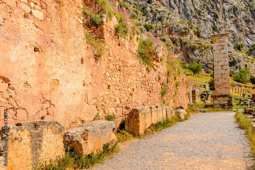 It's Delphi, an archaeological site in Greece, at the Mount Parnassus. Delphi is famous by the oracle at the sanctuary dedicated to Apollo. UNESCO World heritage