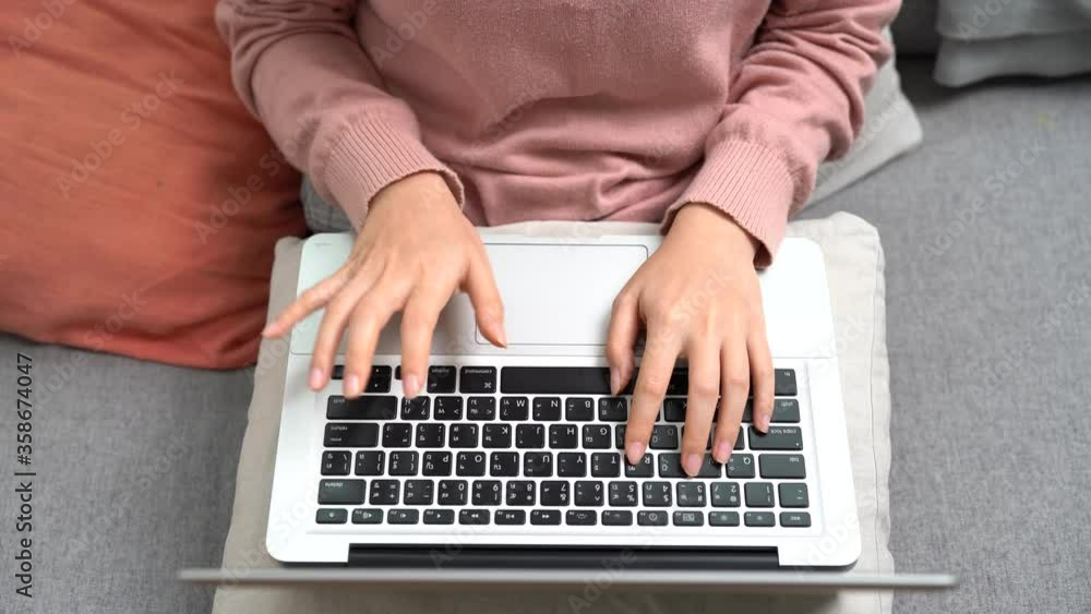 Asian woman also works at home from a laptop computer. Asian woman also works at home from a laptop computer.