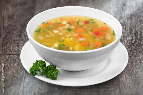 Bowl of delicious vegetable soup on a table
