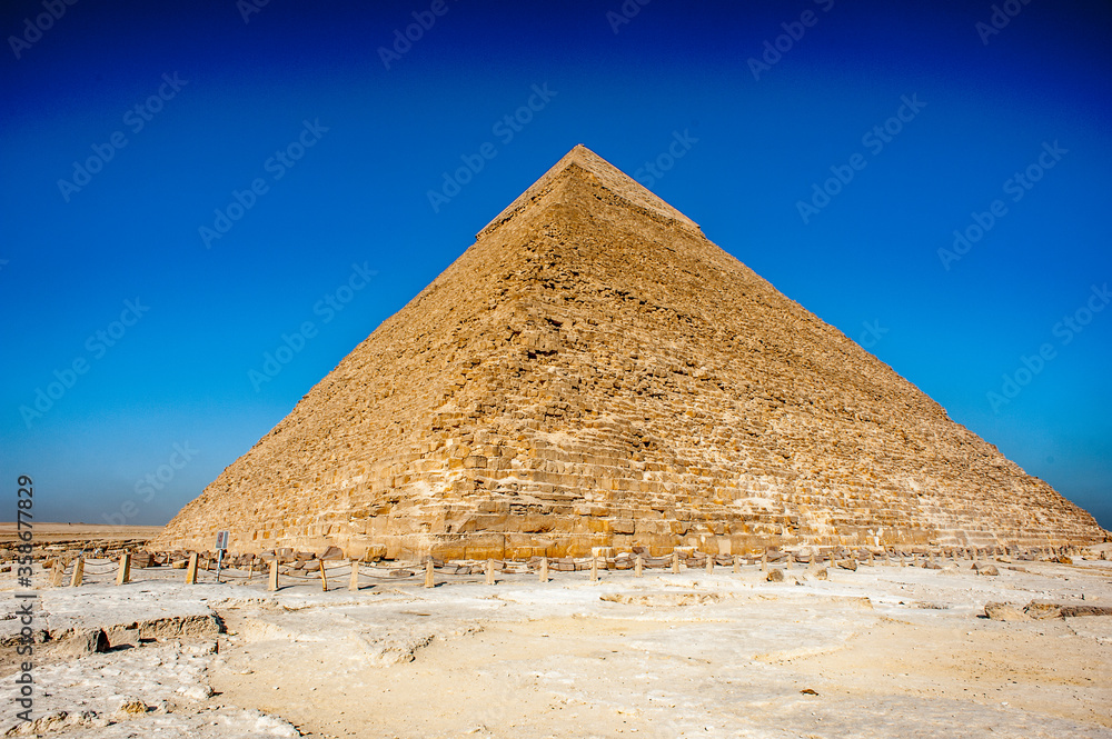 It's Pyramid of Khafre (Pyramid of Chephren), one of the Ancient Egyptian Pyramids of Giza and the tomb of the Fourth-Dynasty pharaoh Khafre