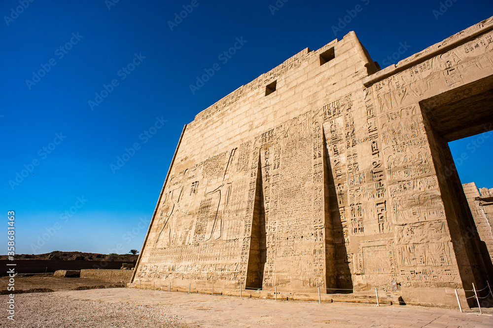 It's Medinet Habu (Mortuary Temple of Ramesses III), West Bank of Luxor in Egypt.