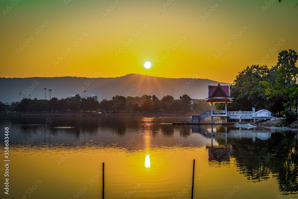 Obraz premium Sunrise over Phu Phan Noi mountain . Nong Bua lake located at the western base of this mountain . Nong Bua lake is the most famous tourist attraction of Nong Bua Lamphu province , Thailand.