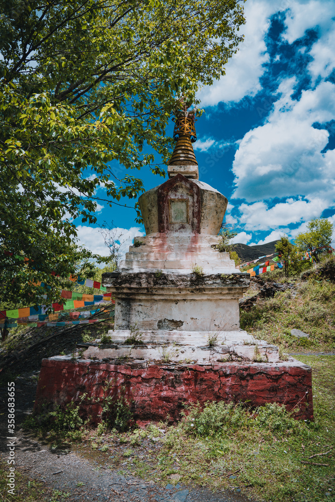 The abandoned and shabby Tibetan pagoda on Xinduqiao mountain in Western Sichuan, China