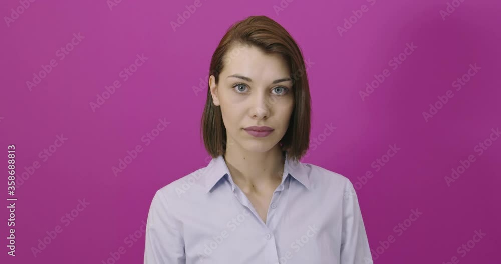 Positive woman smiling over pink backgorund Positive woman smiling over pink backgorund
