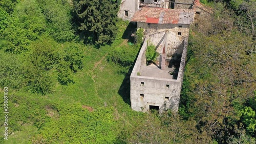 Picturesque abandoned Slapnik village underneath of Korada hill. Aerial photo