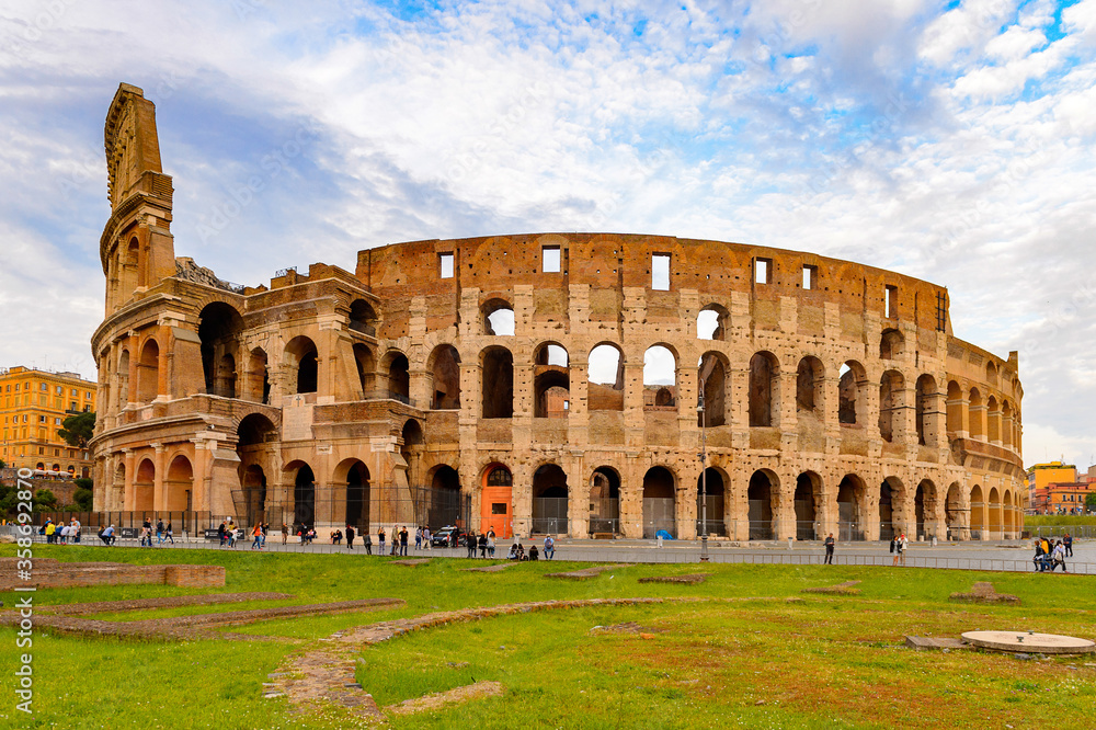 It's Panoramic view of Colosseum or Coliseum in the evening, Rome, Italy. One of the main touristic destinations in Rome