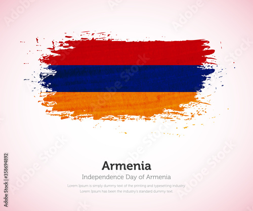 Independence day of Armenia country. Abstract flag in shape of paint brush stroke with shiny colored background