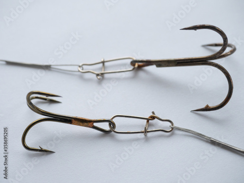 Two big fishing hooks with steel lines photo