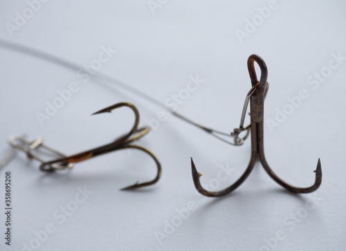 Two big fishing hooks with steel lines photo