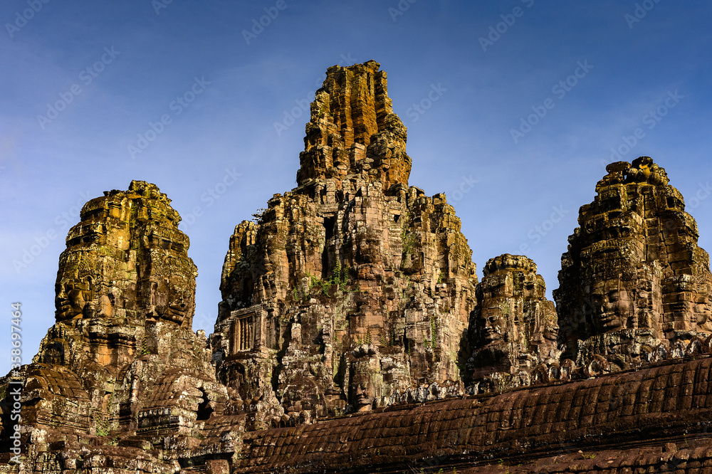 It's Bayon, Khmer temple at Angkor in Cambodia. Official state temple of the Mahayana Buddhist King Jayavarman VII