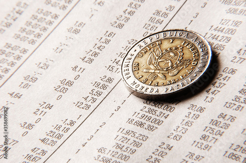 Close up of Argentine Coin over sheet accounts