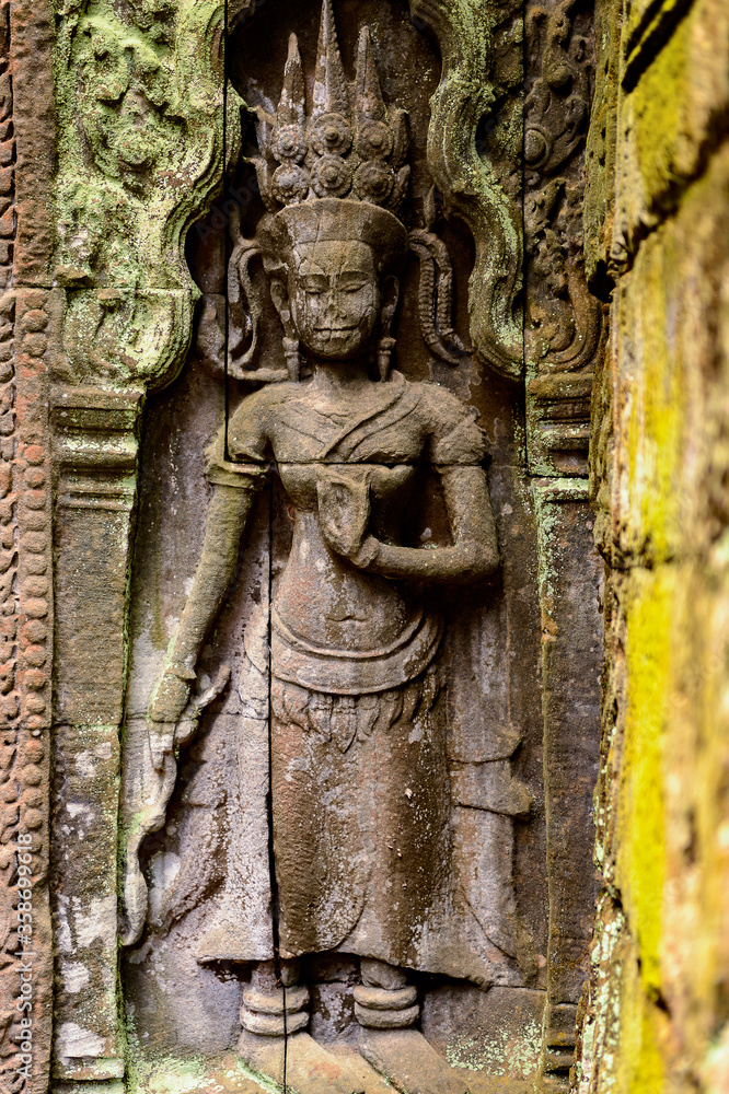 It's Part of the Ta Prohm (Rajavihara), a temple at Angkor, Province, Cambodia. It was founded by the Khmer King Jayavarman VII as a Mahayana Buddhist monastery and university.