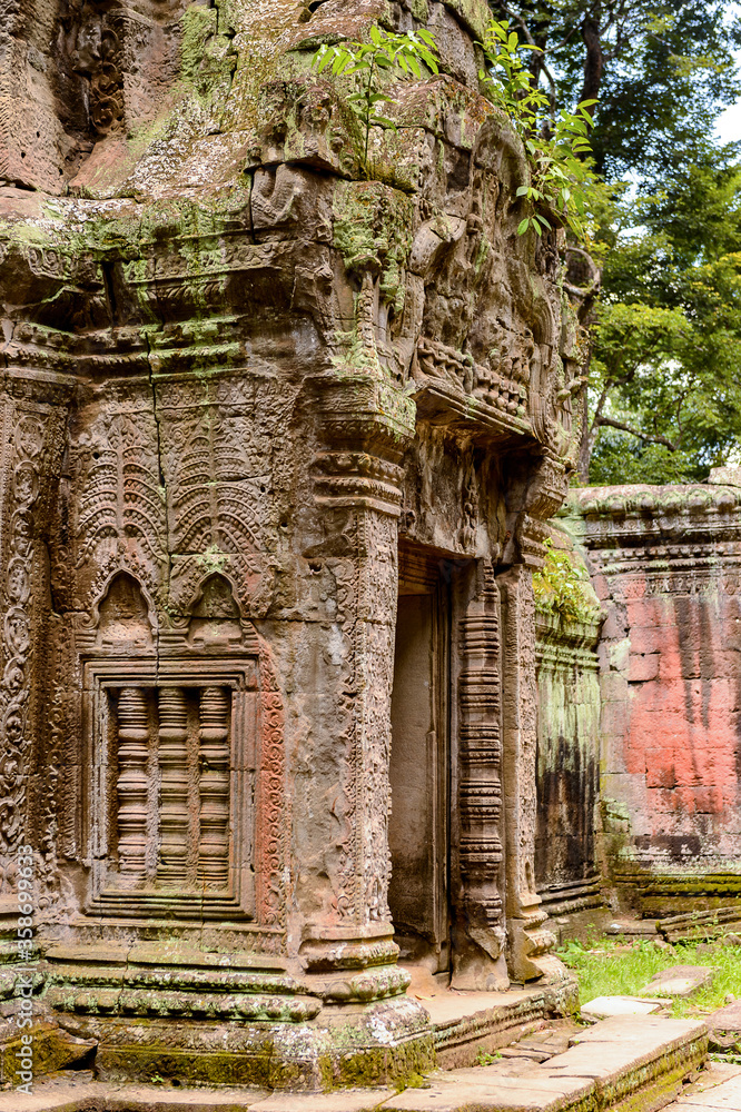 It's Part of the Ta Prohm (Rajavihara), a temple at Angkor, Province, Cambodia. It was founded by the Khmer King Jayavarman VII as a Mahayana Buddhist monastery and university.