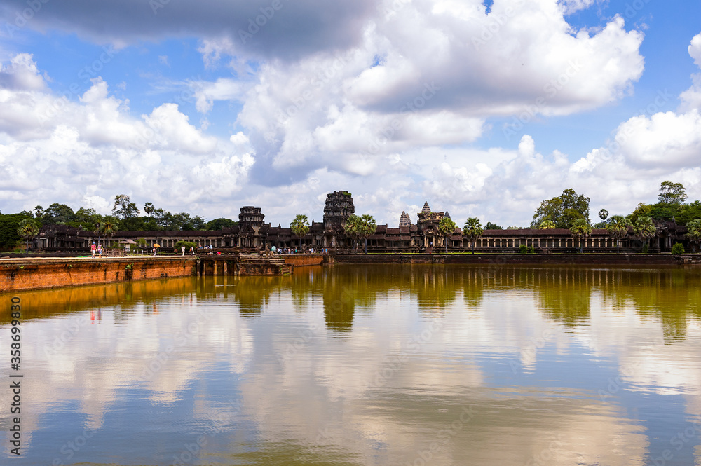 It's Angkor Wat (Temple City) and its reflection, a Hindu, then a Buddhist, temple complex in Cambodia and the largest religious monument in the world.