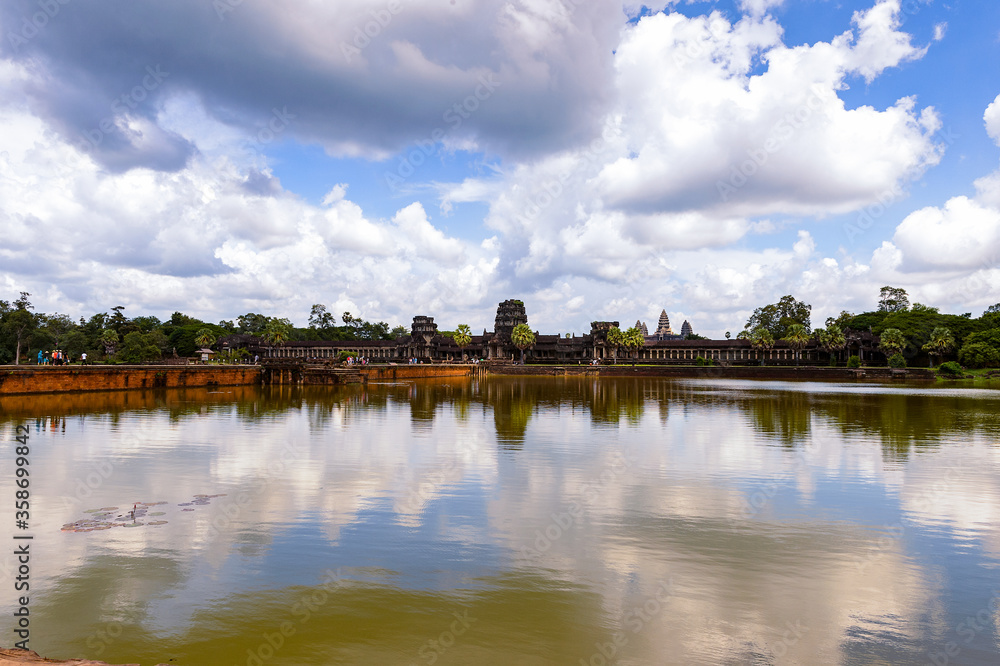 It's Angkor Wat (Temple City) and its reflection, a Hindu, then a Buddhist, temple complex in Cambodia and the largest religious monument in the world. It's Angkor Wat (Temple City) and its reflection, a Hindu, then a Buddhist, temple complex in Cambodia and the largest religious monument in the world.