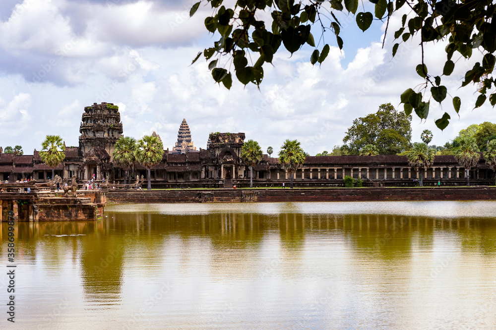 It's Angkor Wat (Temple City) and its reflection, a Hindu, then a Buddhist, temple complex in Cambodia and the largest religious monument in the world. It's Angkor Wat (Temple City) and its reflection, a Hindu, then a Buddhist, temple complex in Cambodia and the largest religious monument in the world.