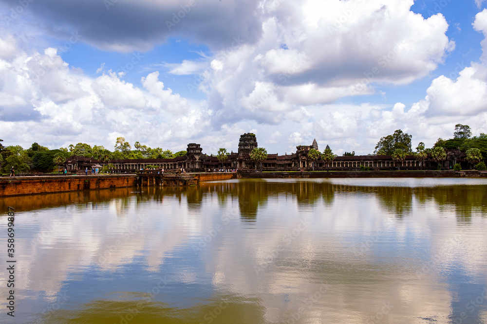It's Angkor Wat (Temple City) and its reflection, a Hindu, then a Buddhist, temple complex in Cambodia and the largest religious monument in the world.