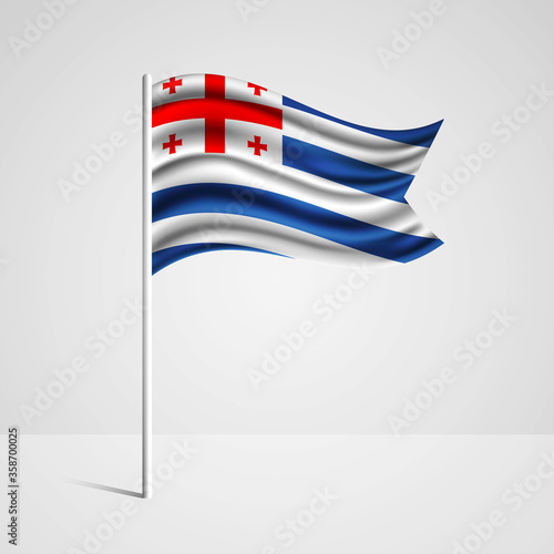 Realistic Adjara country flag waving in wind. Abstract country flag with flagpole isolated on grey background