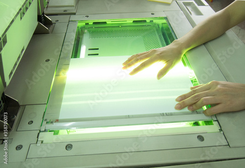 woman hands in using copy machine
