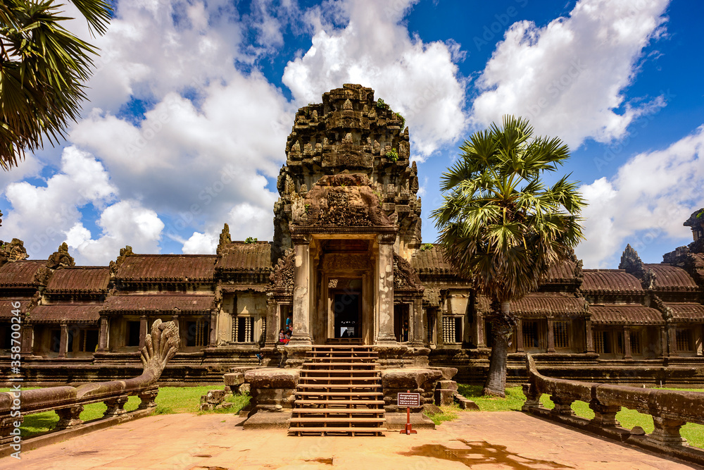 Naklejka premium It's Angkor Wat (Temple City), a Buddhist, temple complex in Cambodia and the largest religious monument in the world. View from the garden
