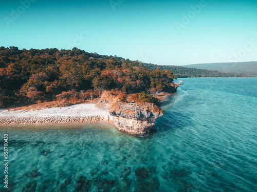 Aerial drone view of an empty beach in tropical Moyo Island, Sumbawa, Indonesia photo