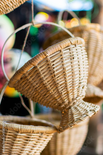 a hanging bamboo basket in selective focus