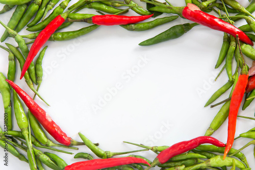 Flat lay red hot chillii peppers pattern isolated on white with clipping path. Red spicy chili peppers wallpaper pattern. Top view or flat lay.